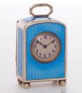 A sub miniature Swiss Art Deco silver guilloche translucent enamel travel clock, circa 1920.